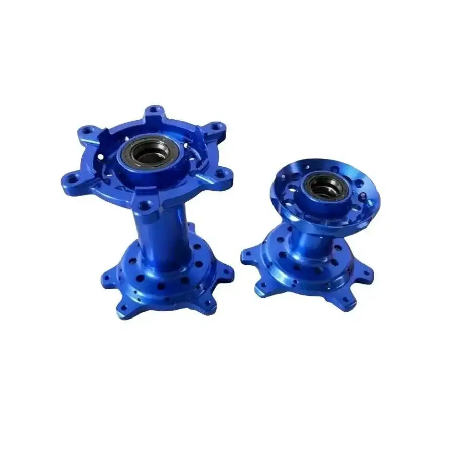 Blue anodized aluminum Sur Ron Ultra Bee 19-inch wheel hub with rainbow spokes