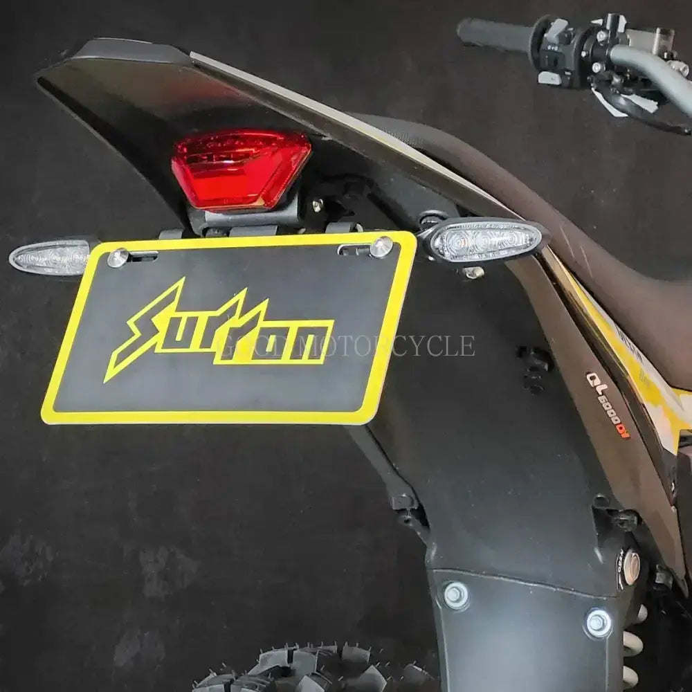 Yellow black Surron Ultra Bee license plate with lightning bolt design