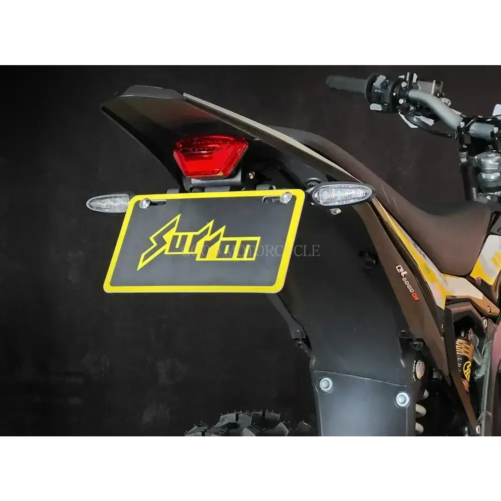 Sleek yellow black Surron Ultra Bee collapsible rear license plate holder